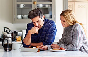 Couple reviewing invoice on iPad